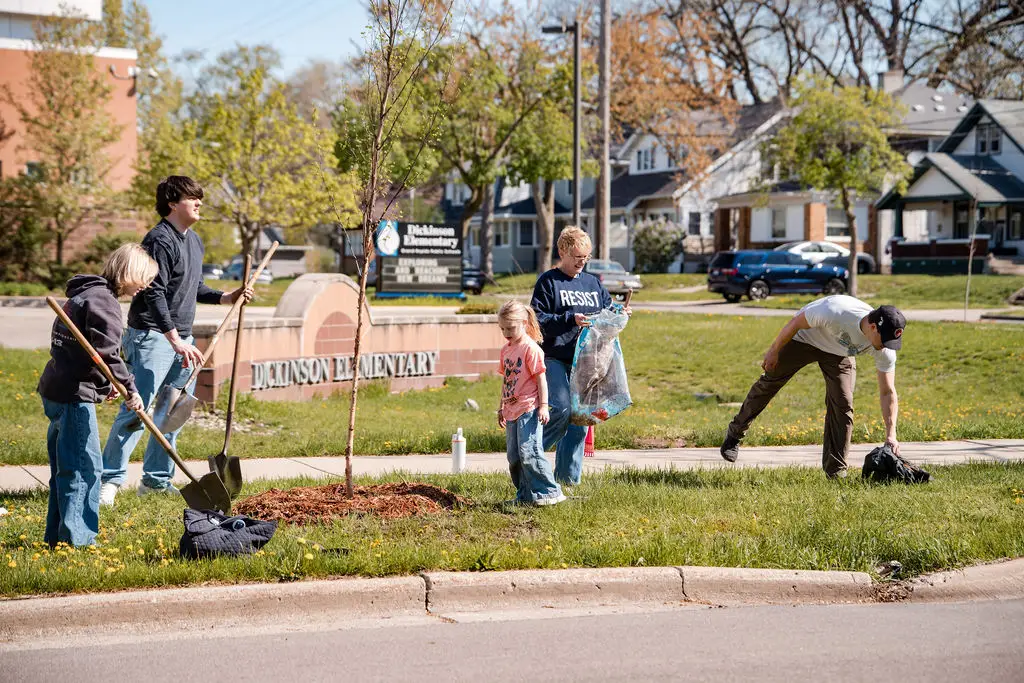 group of people planting trees